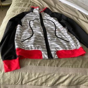 Lululemon  jacket size 10  black white and gray with dark orange trim